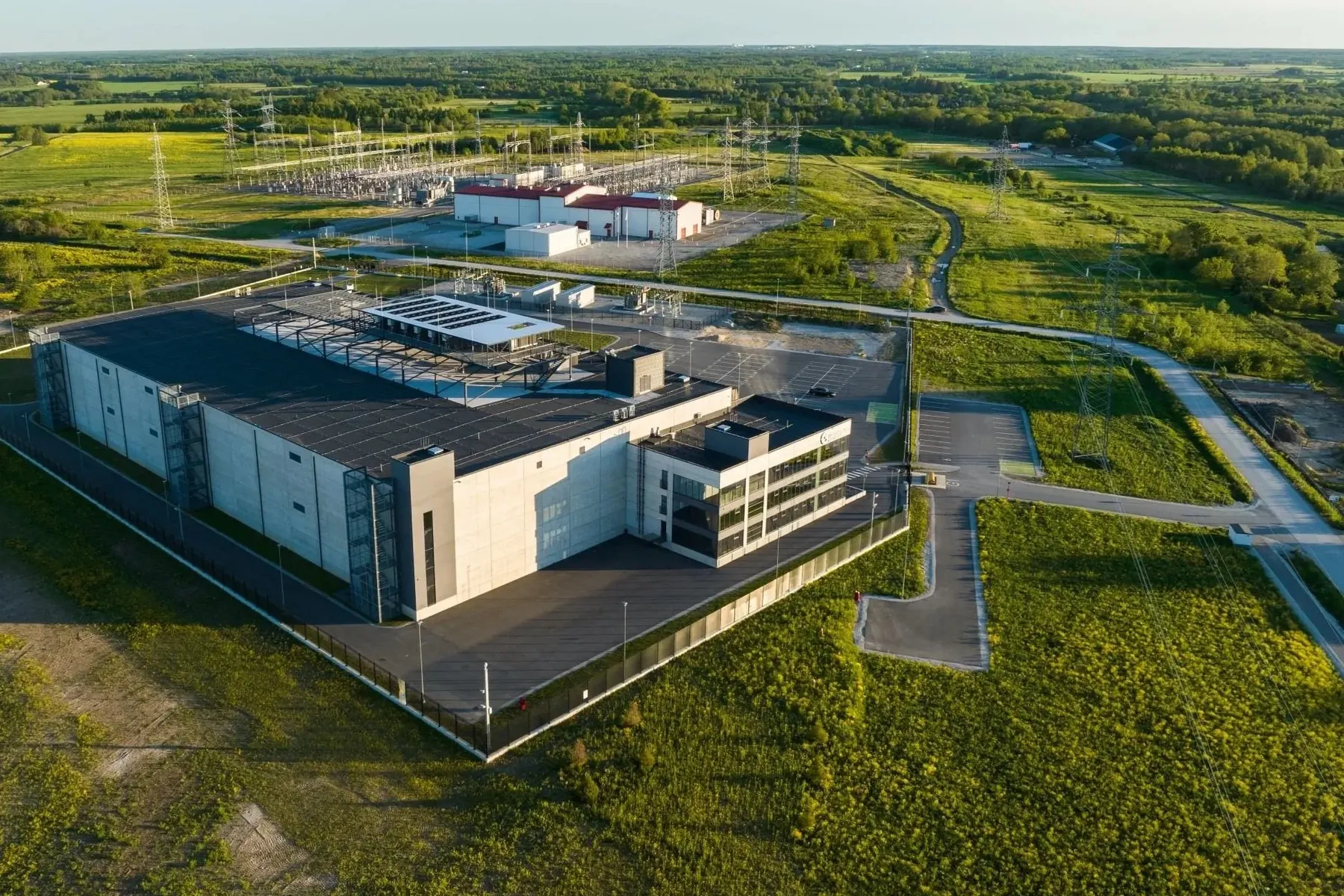 Aerial view of the Greenergy Data Centers facility in Tallinn with the Harku high-voltage substation behind it